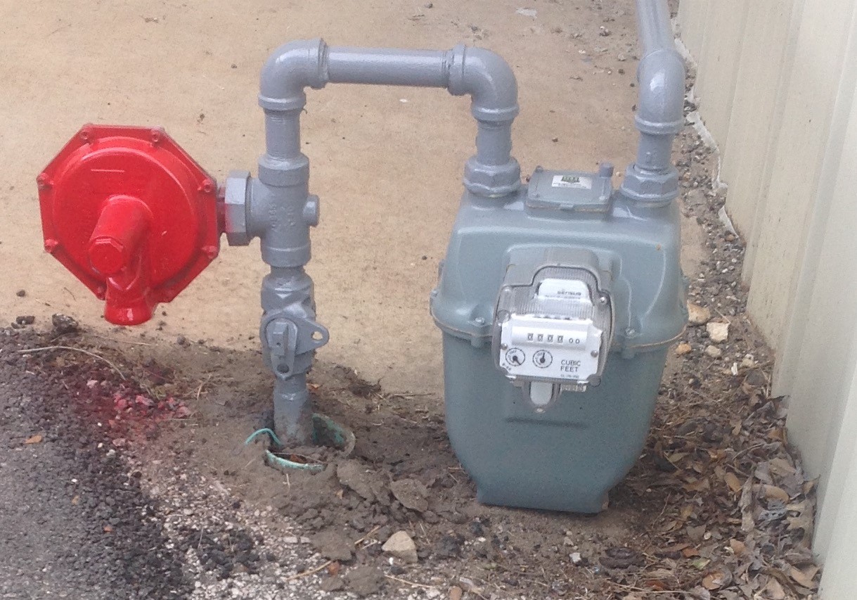 gas excess flow valve with in red with a gas meter